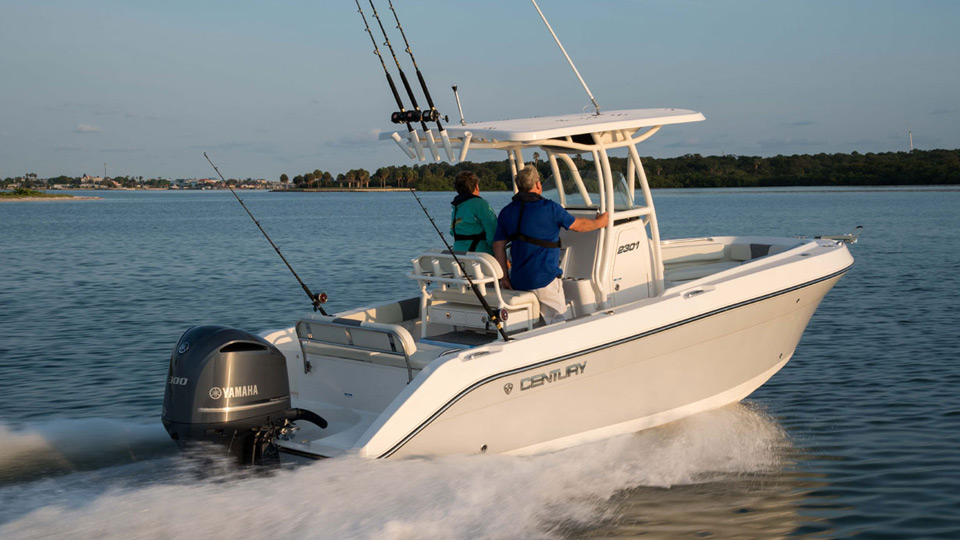 2 men heading out to sea on a fishing boat